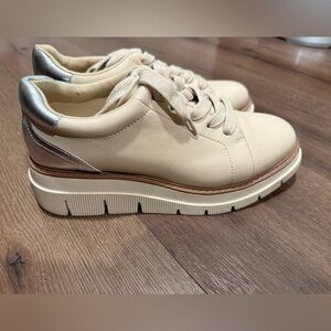 Stylish Cream Sneakers with Silver Accents by Liverpool